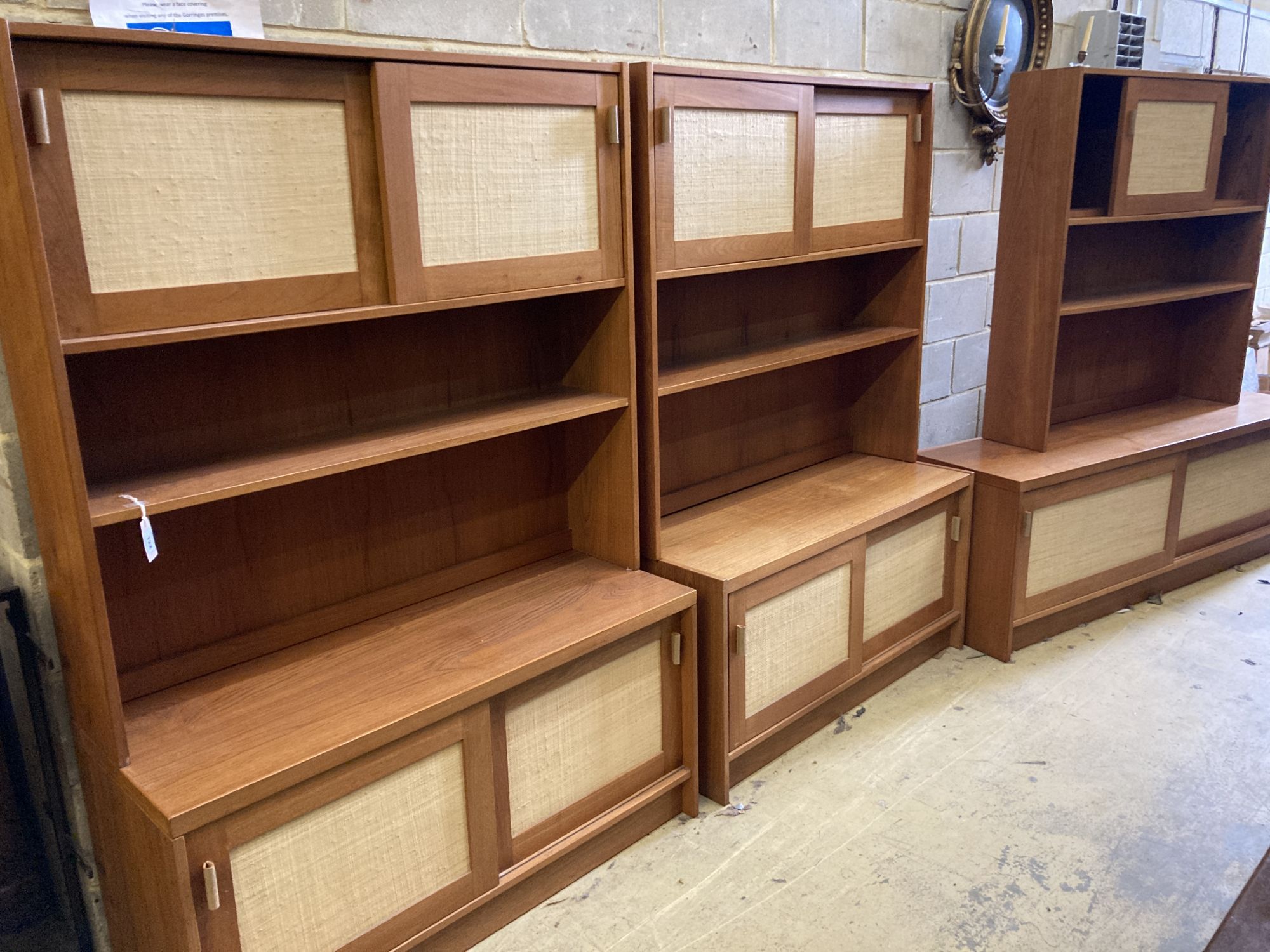 Three near-matching teak side cabinets,